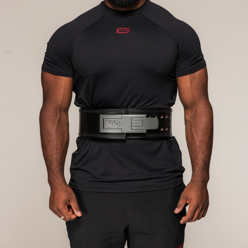 SBD 13mm Lever Belt in black, front view worn around an athlete's waist