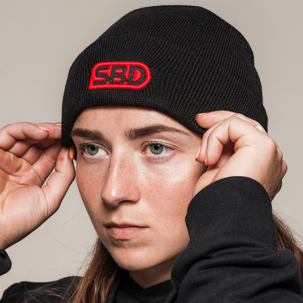 Black SBD Beanie, close-up of the folded cuff and red logo