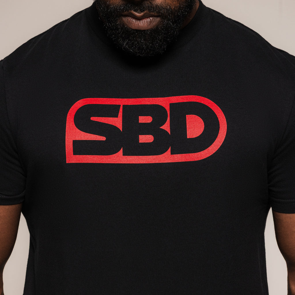 Black SBD T-Shirt, close-up of the large red chest logo