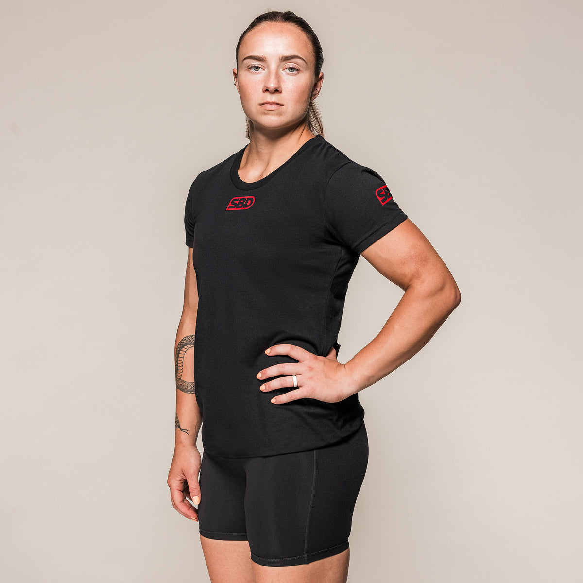 Women's black SBD Competition T-Shirt with red logos, front view
