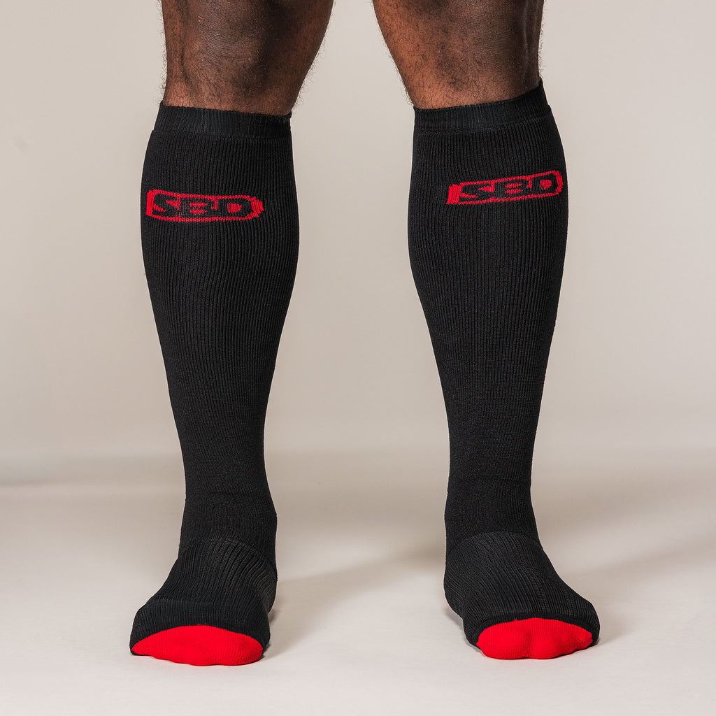Black SBD Deadlift Socks with red logos and toes, front view