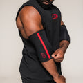 Black SBD Elbow Sleeve with red stripe, being adjusted on an athlete