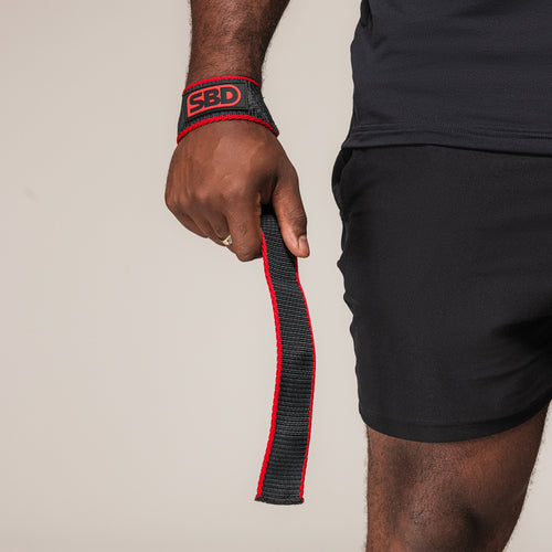Black and red SBD Lifting Strap showing its flat loop and extended length