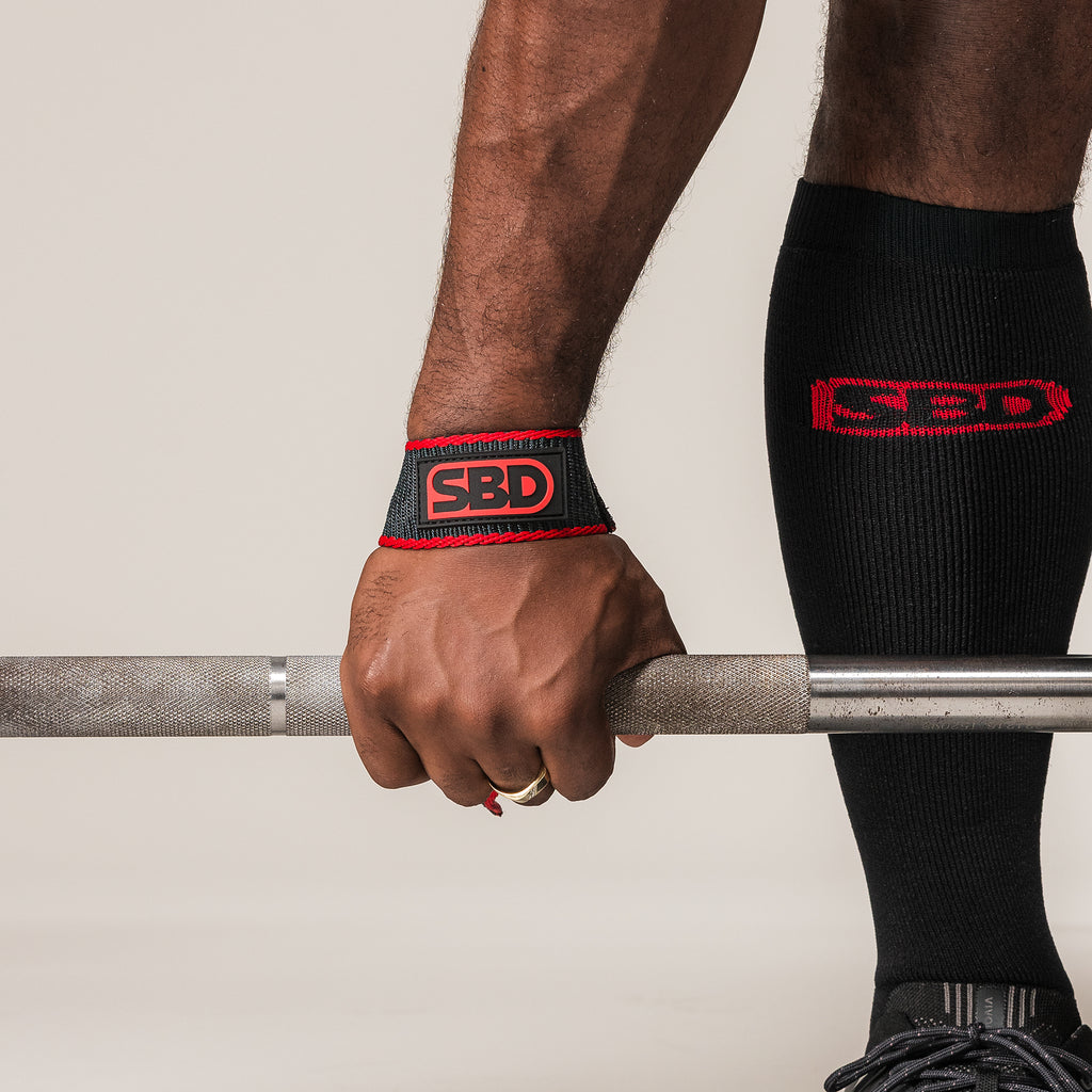 SBD Lifting Strap wrapped around a barbell to secure an athlete's grip