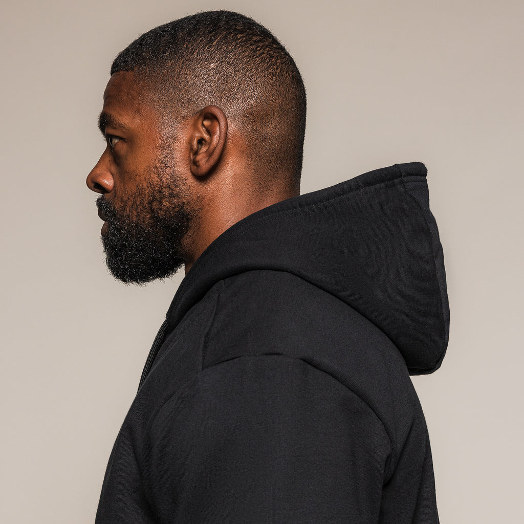 Black SBD Hoodie, side view showing the hood