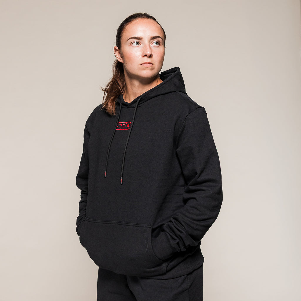 Black SBD Hoodie, front three-quarter view on an athlete