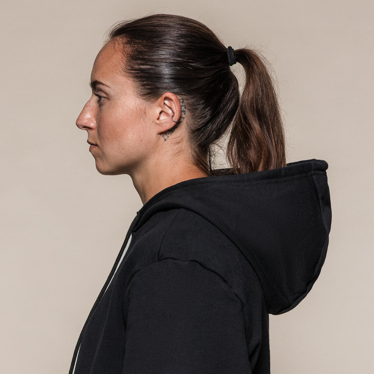 Black SBD Hoodie, side view of the hood and neckline