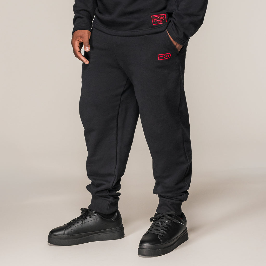 Black SBD Joggers, front view showing the tapered legs and ankle cuffs