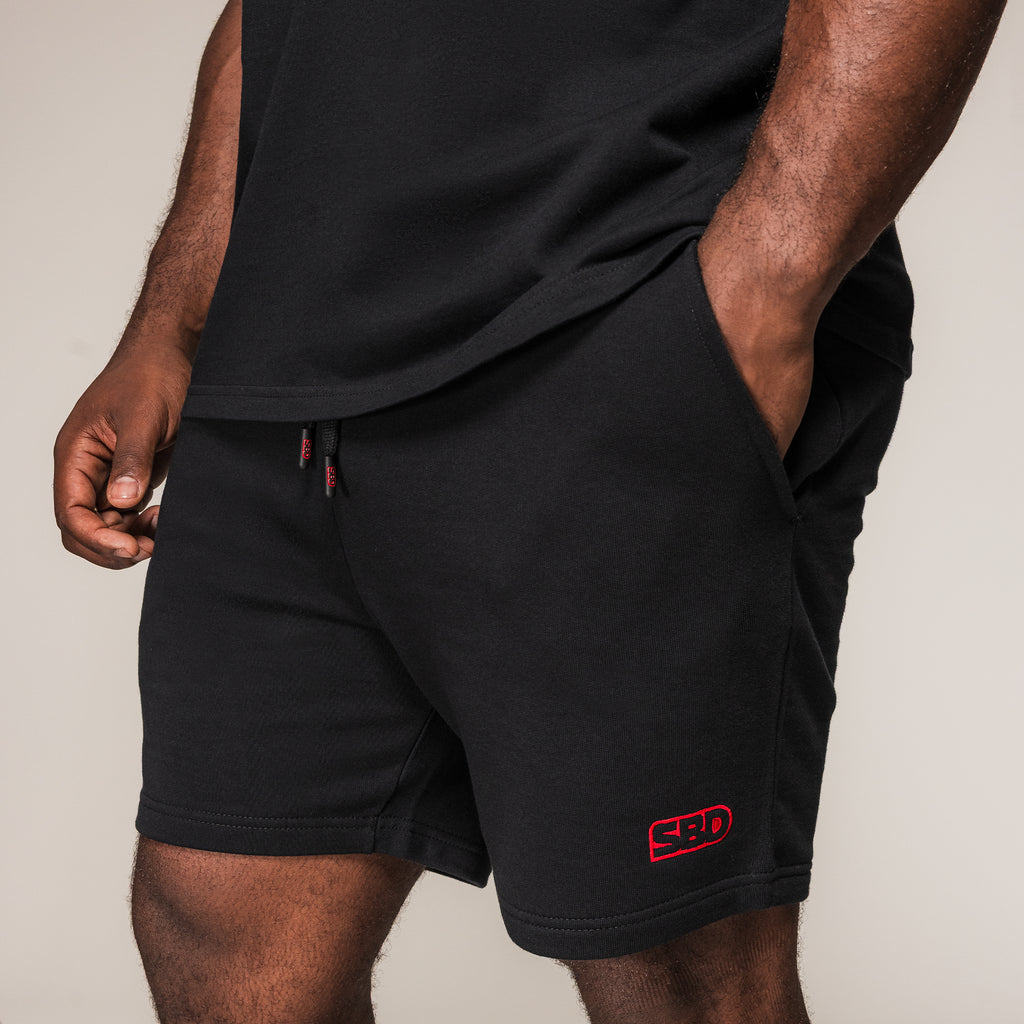 Men's black SBD Shorts with red embroidered logo, front view