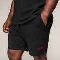 Men's black SBD Shorts with red embroidered logo, front view
