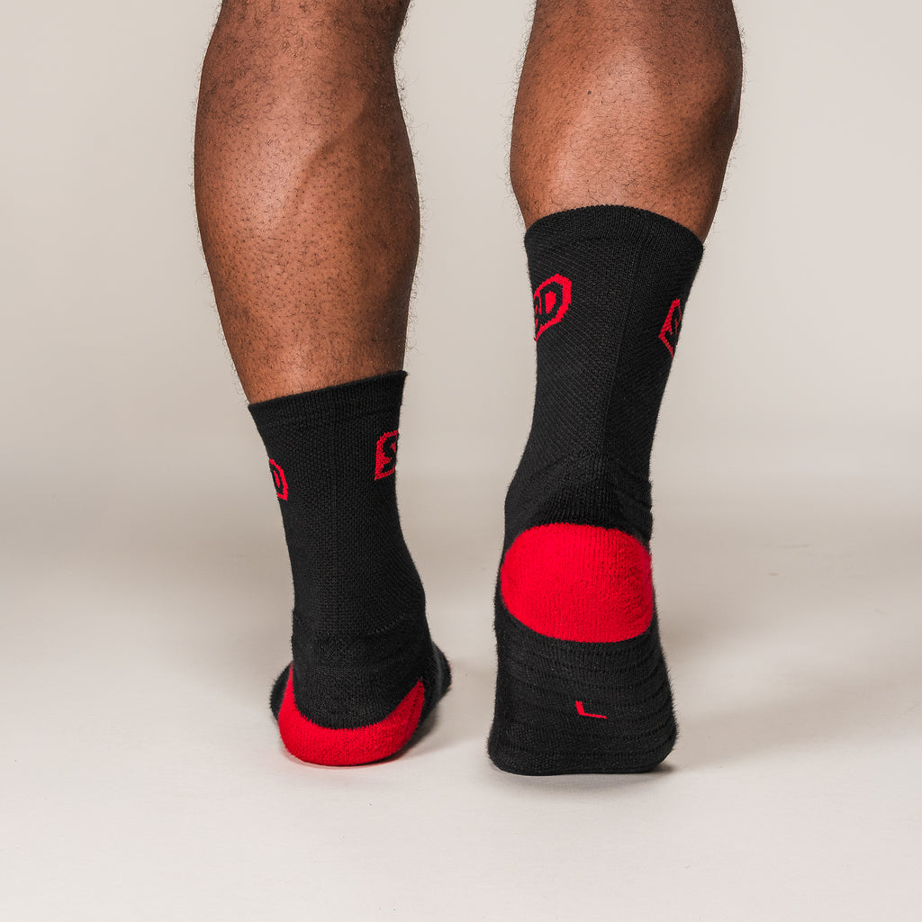 Black and red SBD Sports Socks, rear view showing the heel panels